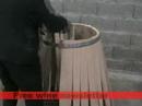 A cooper making a wine barrel