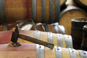 A hammer on a wine barrel