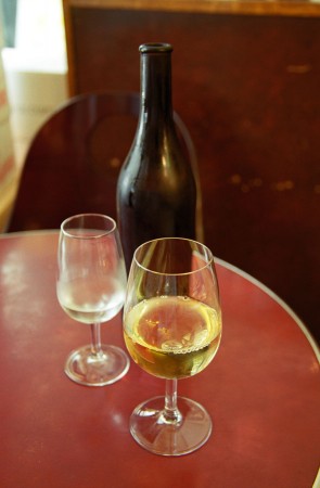 Glass and bottle on a cafe table