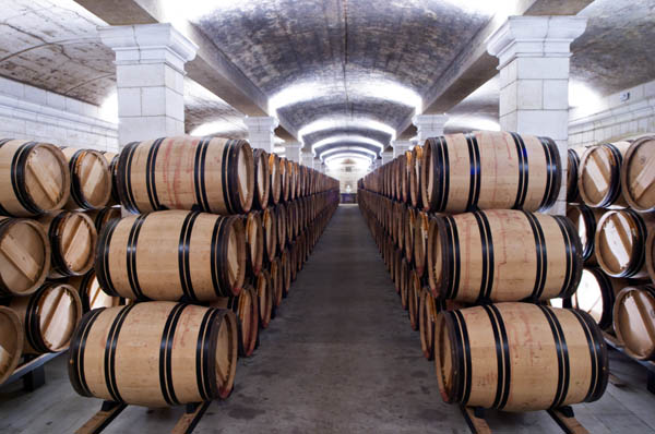 Barrels piled high in the wine cellar