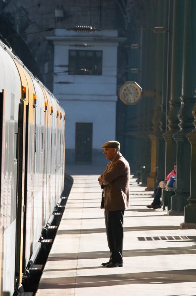 A main standing waiting on a train platform