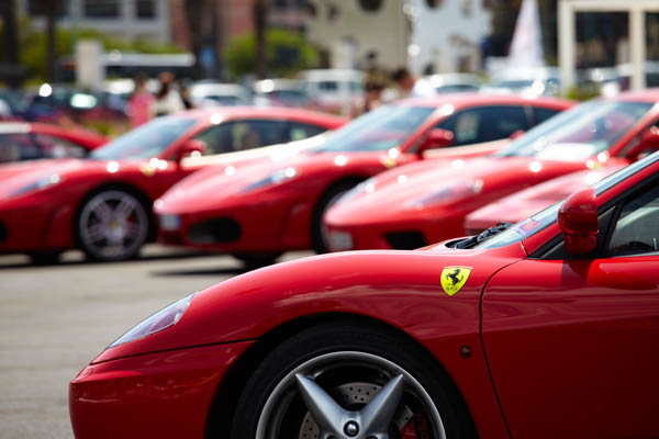 Red cars in a parking lot