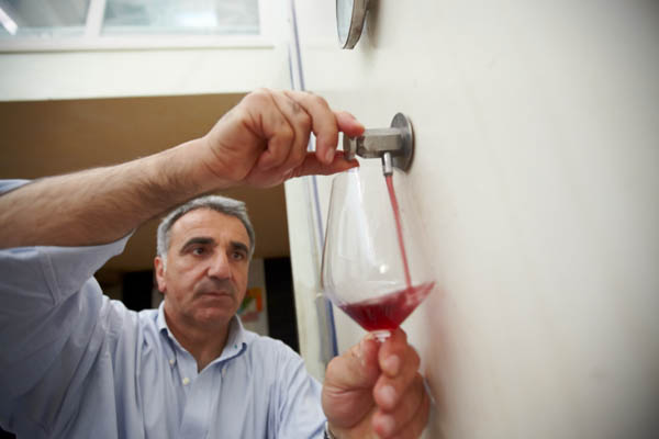 Giusto Occhipinti, COS, taking a wine sample from a tank