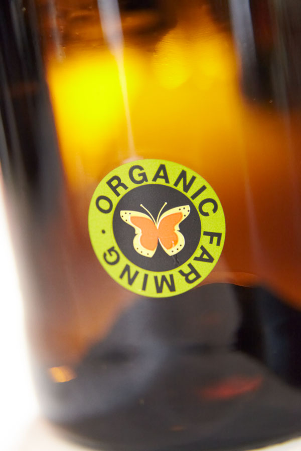 A bottle with an organic farming symbol