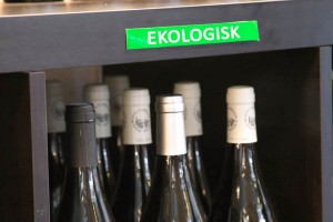Bottles in a wine shop marked organic wine (ekologiskt)