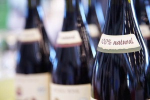 Wine bottle necks with label 100% Natural