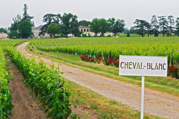 Chateau Cheval Blanc, its vineyard and a road, Saint Emilion, Bordeaux