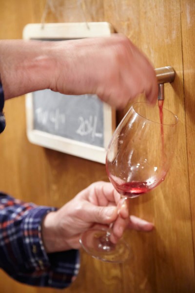 Pouring a sample of wine in the cellar