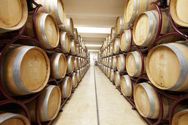 Oak barrels resting in the cellar at the Rapitala winery