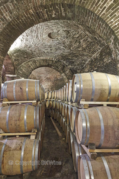 Oak barrels in a wine cellar in Piedmont