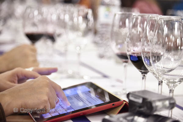 A wine blogger writing tasting notes