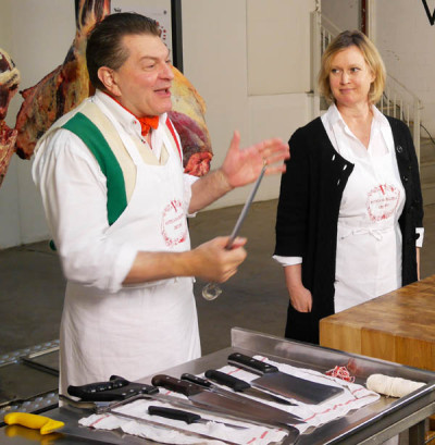 Dario Cecchini preparing his butcher's tools with Kim Wicks