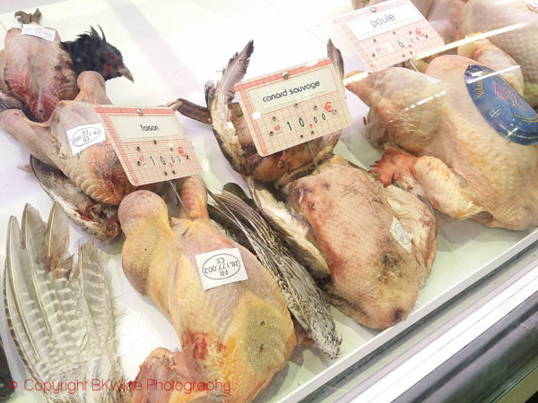 Pheasant, wild duck and other game birds at a market in Paris