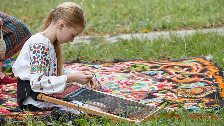 A girl working on a traditional embroidery in Moldova