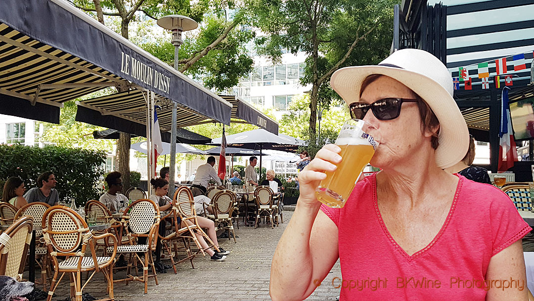 Britt Karlsson drinking beer in a café in Paris