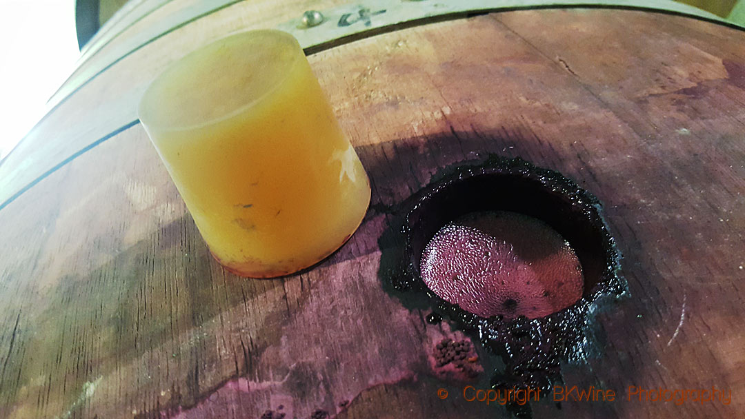 Wine fermenting in a barrel at Domaine de Mourchon, Rhone
