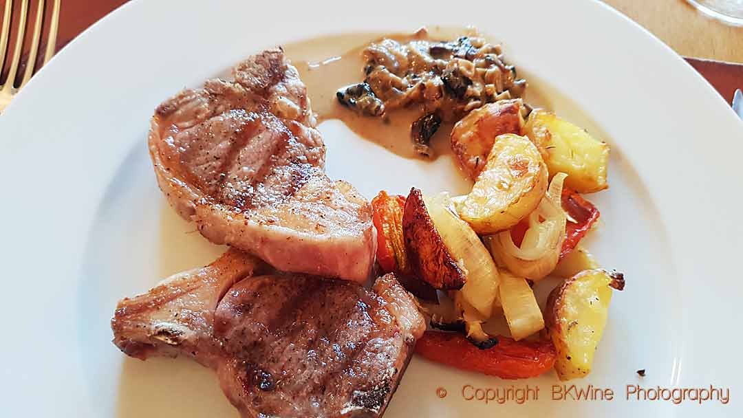 Grilled lamb chops with creamy mushroom sauce and roast potato wedges