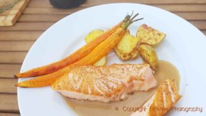 Pan-fried salmon with carrots and roast potatoes