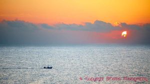 Sunset in Sicily with fishing boat