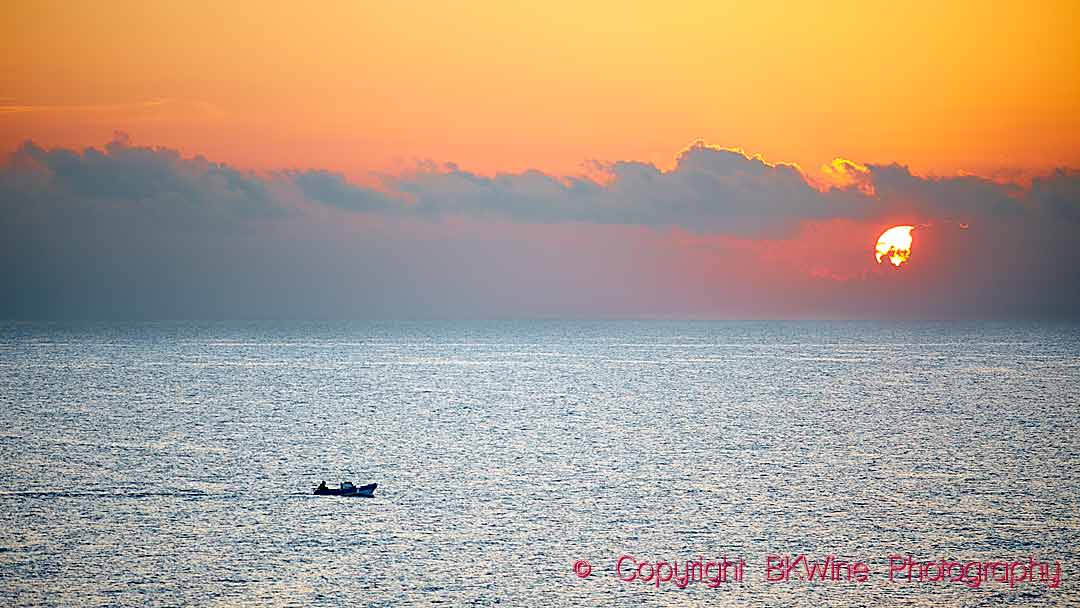 Sunset in Sicily with fishing boat