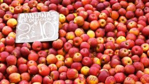 A market stall on a street market selling apples