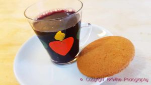 Home-made glogg (glögg) in grandma's hand-painted cup and a pepparkaka (ginger biscuit)