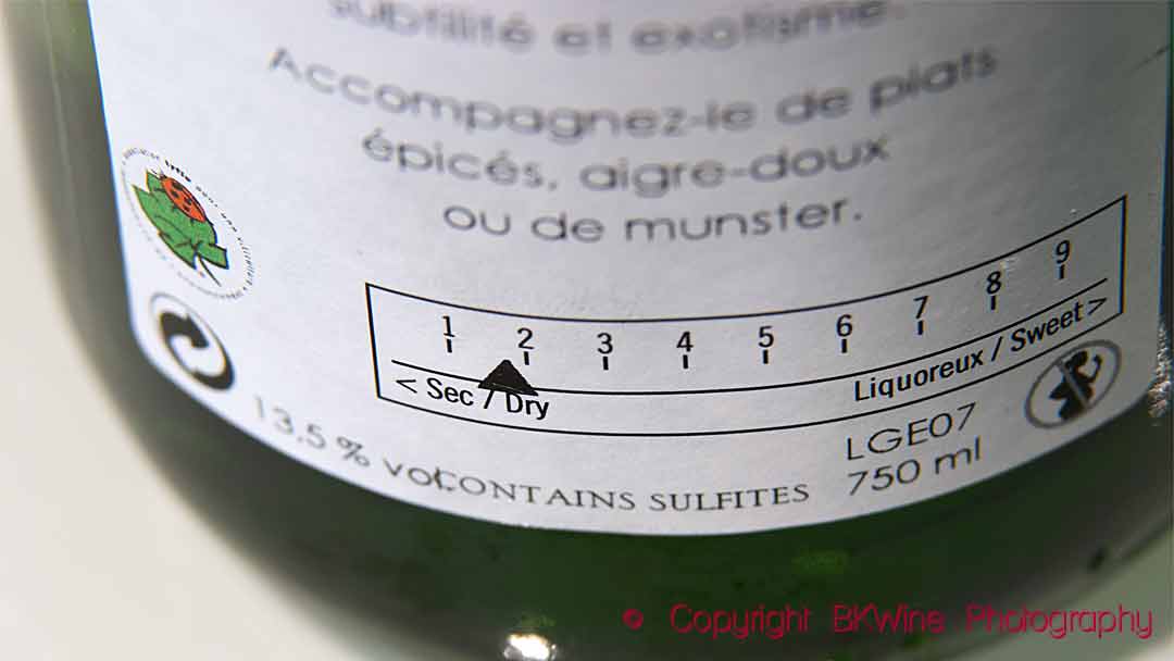 A back label showing dry-to-sweet scale on an Alsace wine
