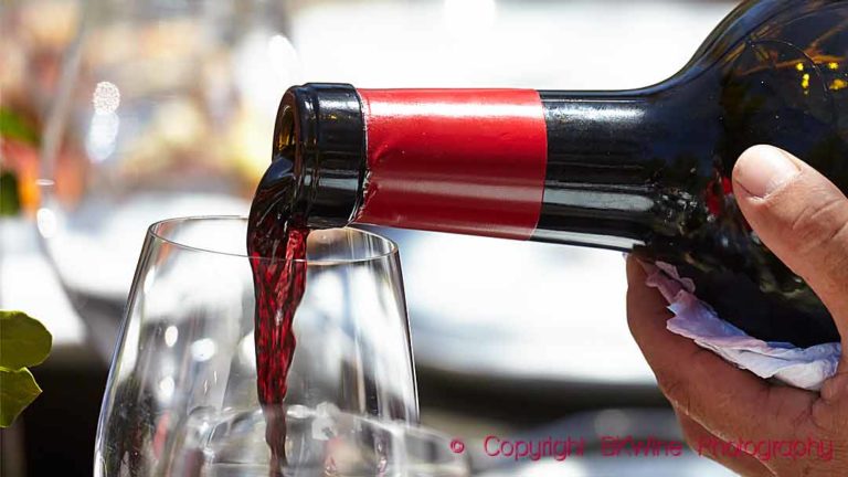 Wine poured from a double magnum bottle into a glass in Chile