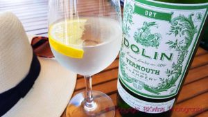 A refreshing aperitif, Dolin dry vermouth with some tonic water, a dash of gin and a lemon slice