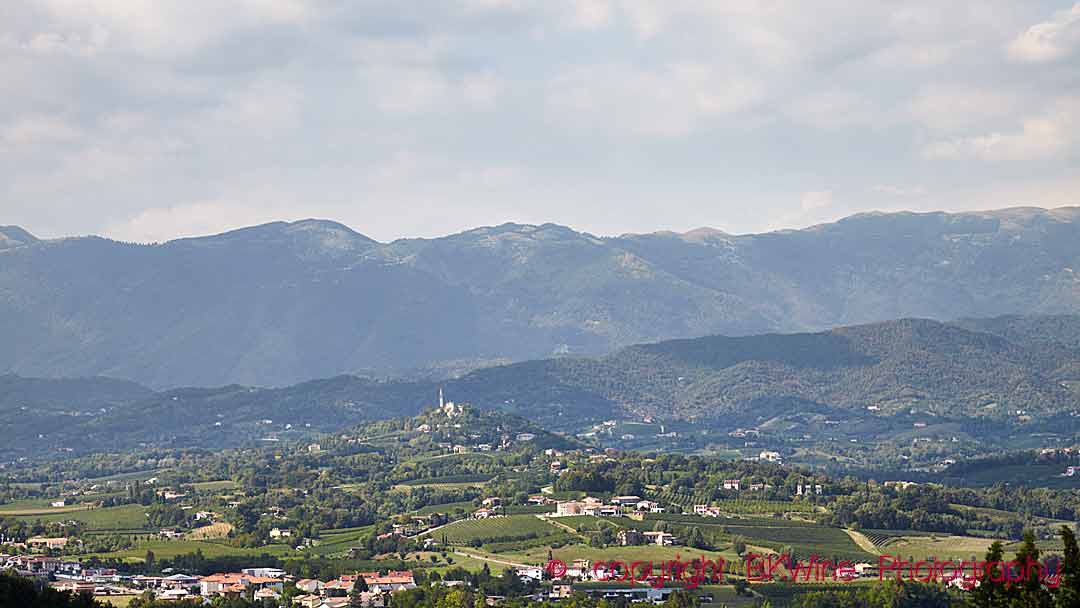 Vineyard and mountain landscape with village in Conegliano-Valdobbiadene (Prosecco) in Veneto