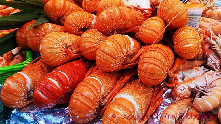 Langouste (spiny lobster) and langoustine at a fish market in Paris