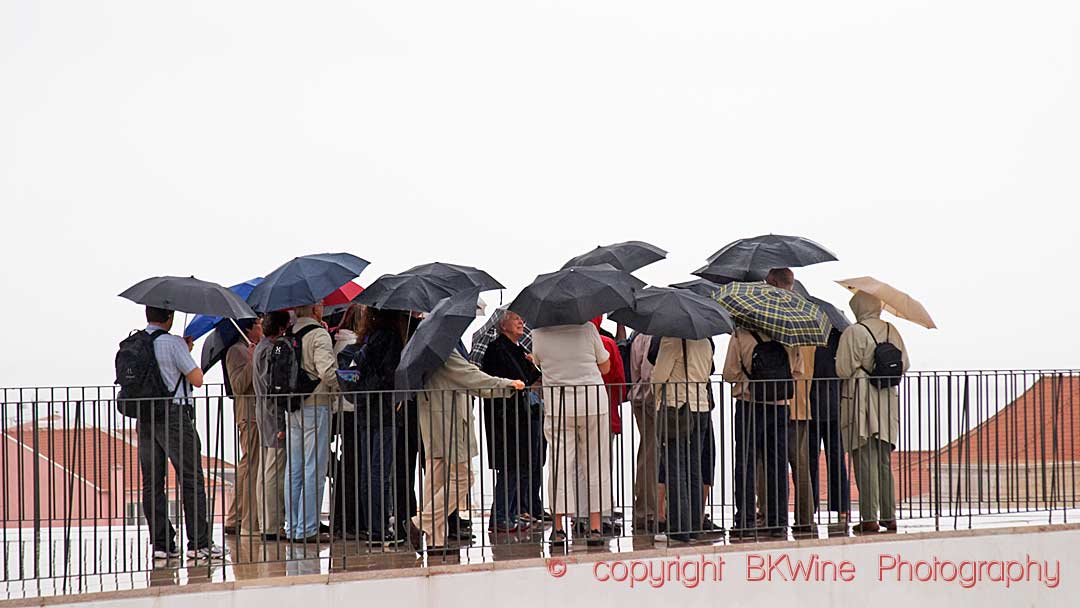 A rainy day (in Lisbon), with people with umbrellas