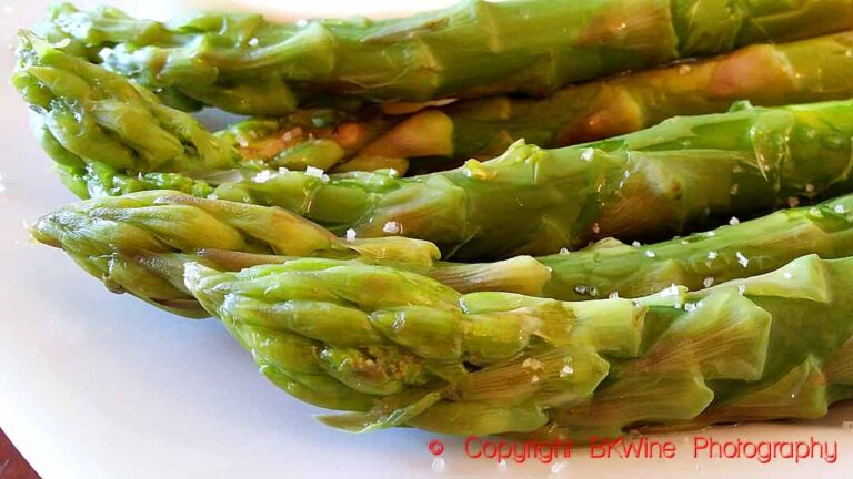 The tips of green asparagus sprinkled with salt